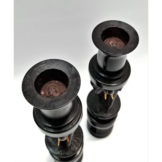 A pair of Elephant Curved Ebony Candle Holders