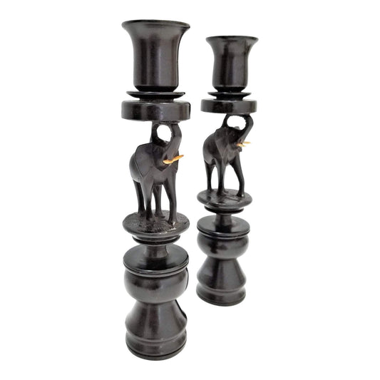 A pair of Elephant Curved Ebony Candle Holders