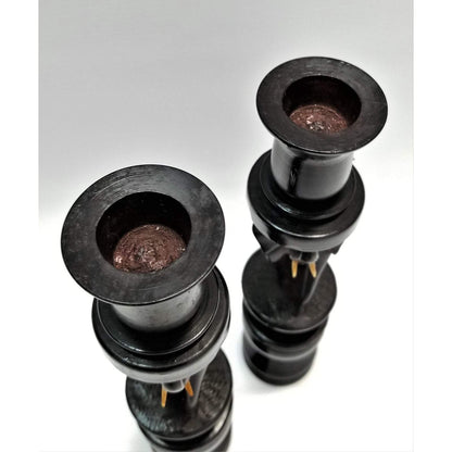 A pair of Elephant Curved Ebony Candle Holders