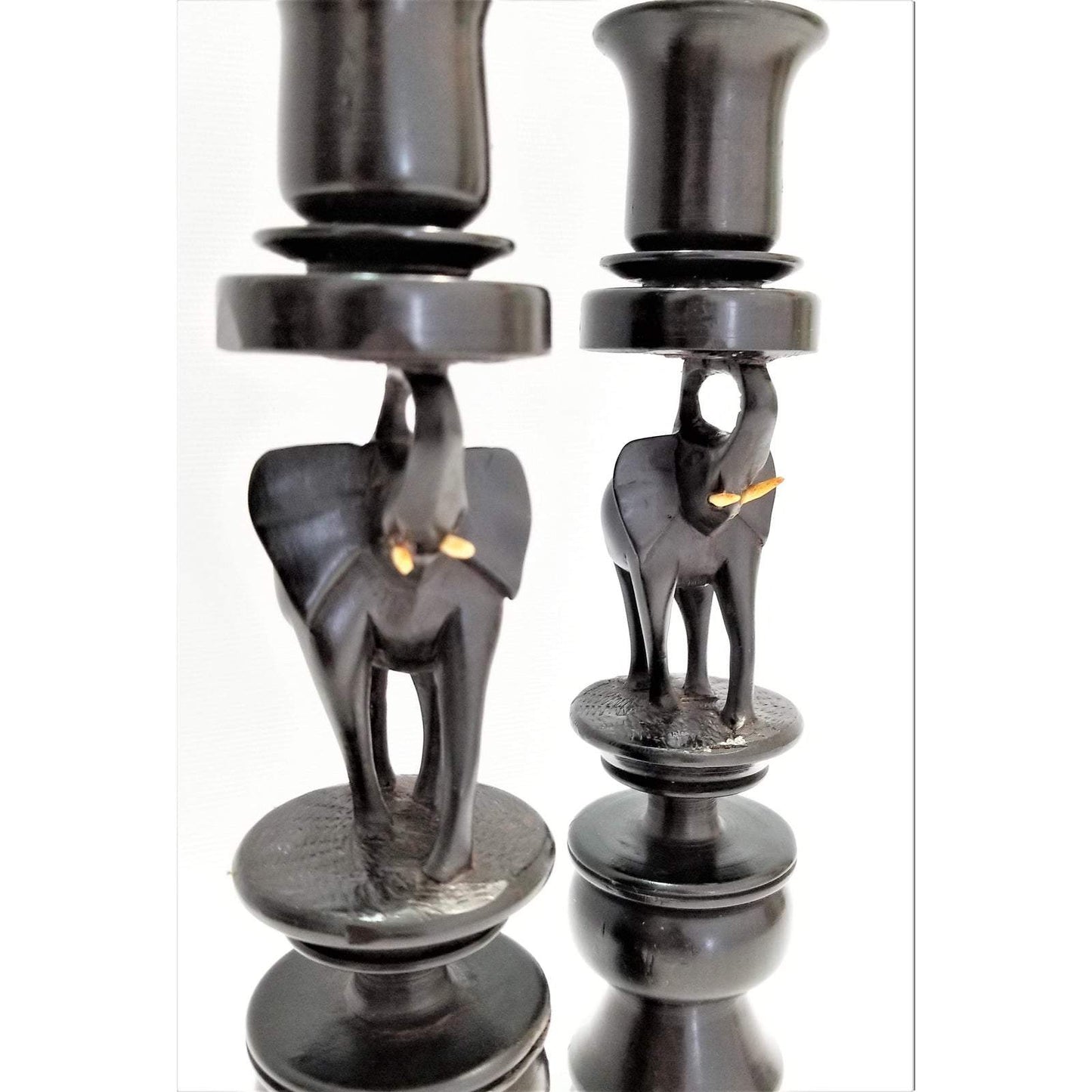 A pair of Elephant Curved Ebony Candle Holders