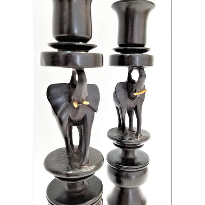 A pair of Elephant Curved Ebony Candle Holders